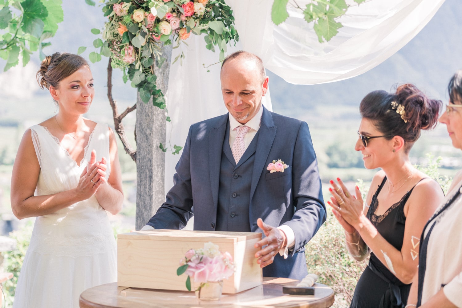 The bride, groom and friends participate to a symbolic ritual