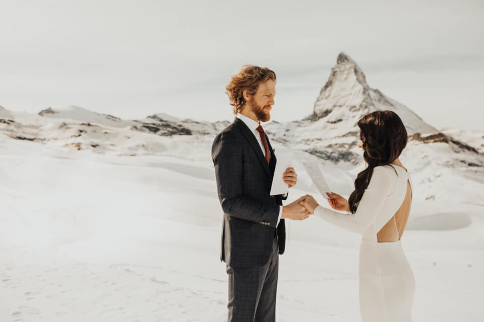 Couple exchanging vows in front of the Matterhorn in Zermatt