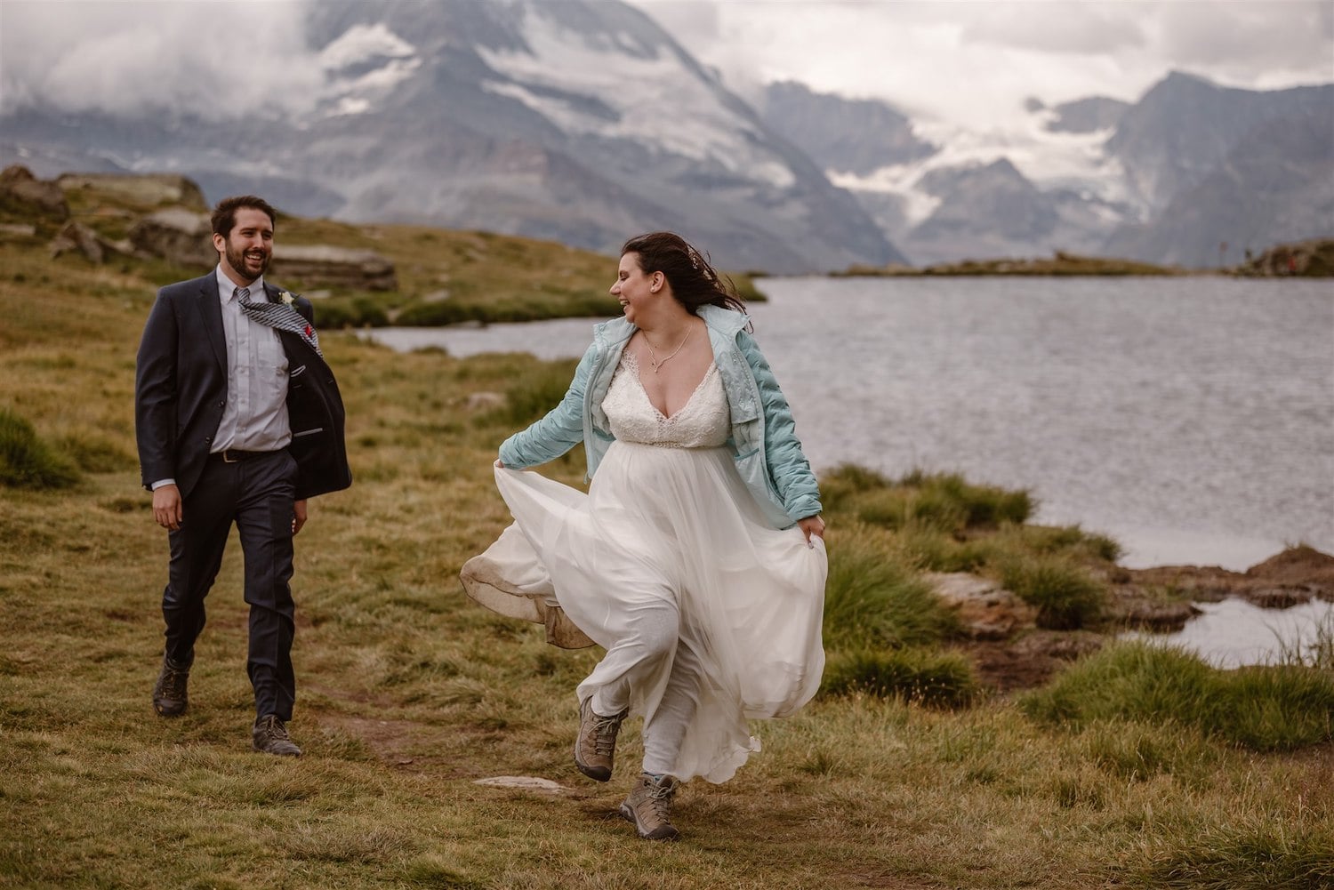 Couple running to their wedding ceremony in Switzerland