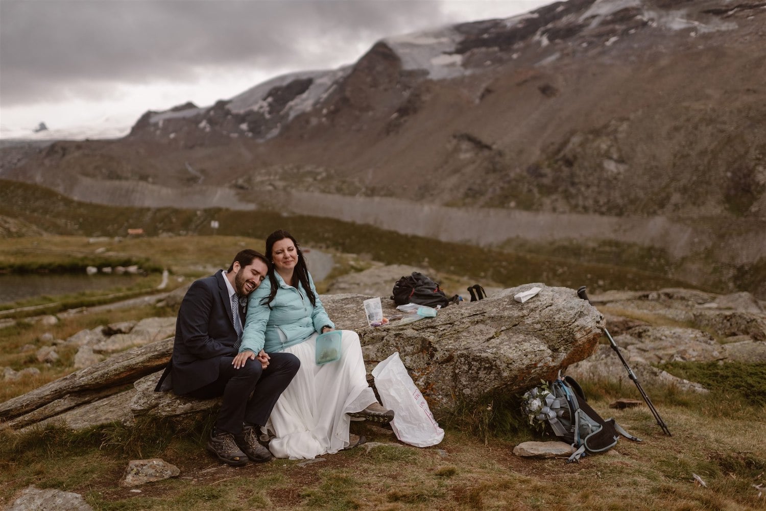 Newlyweds having picnic after their elopement ceremony in Zermatt
