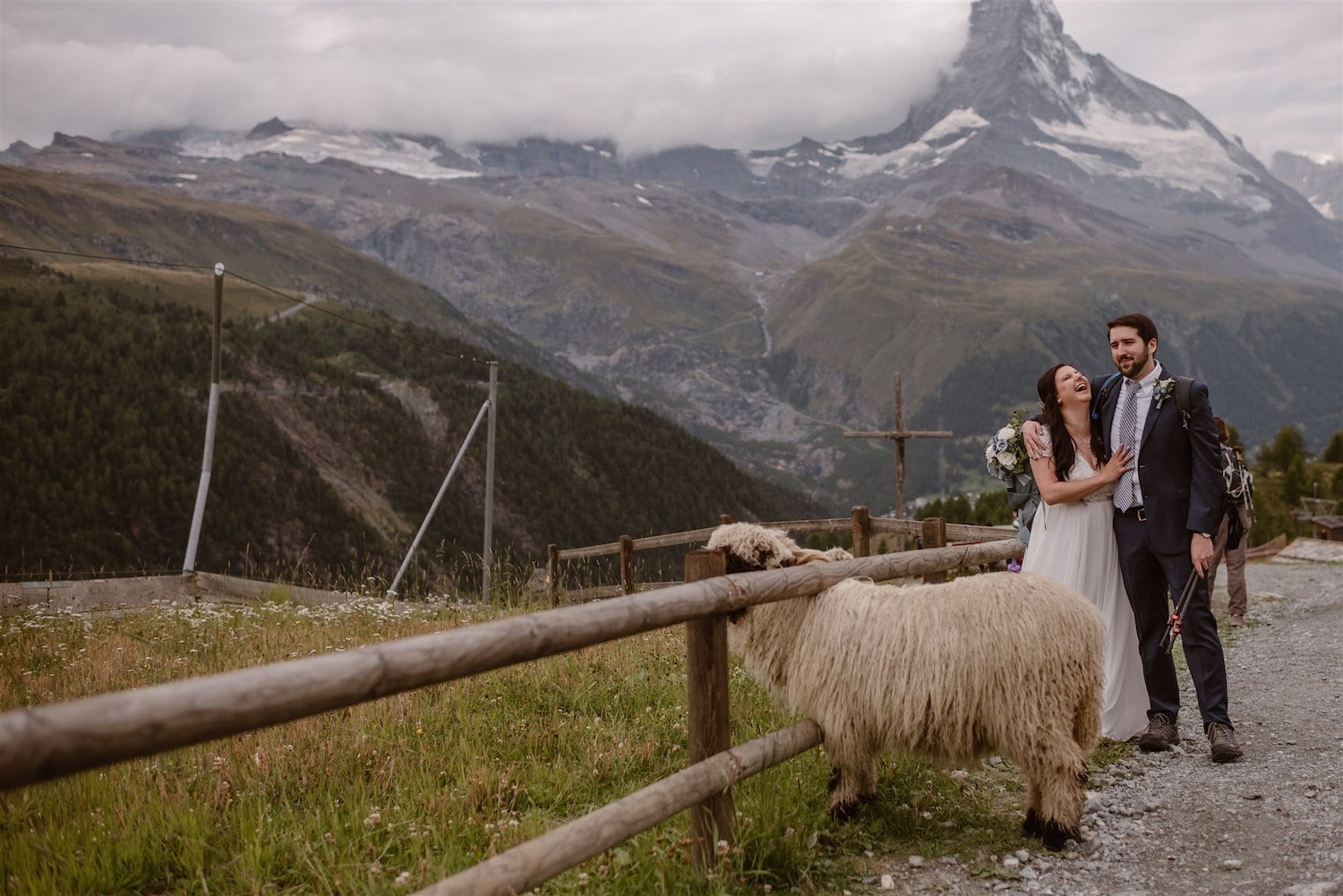 Lovers laughing and looking forward to getting married in front of the Matterhorn