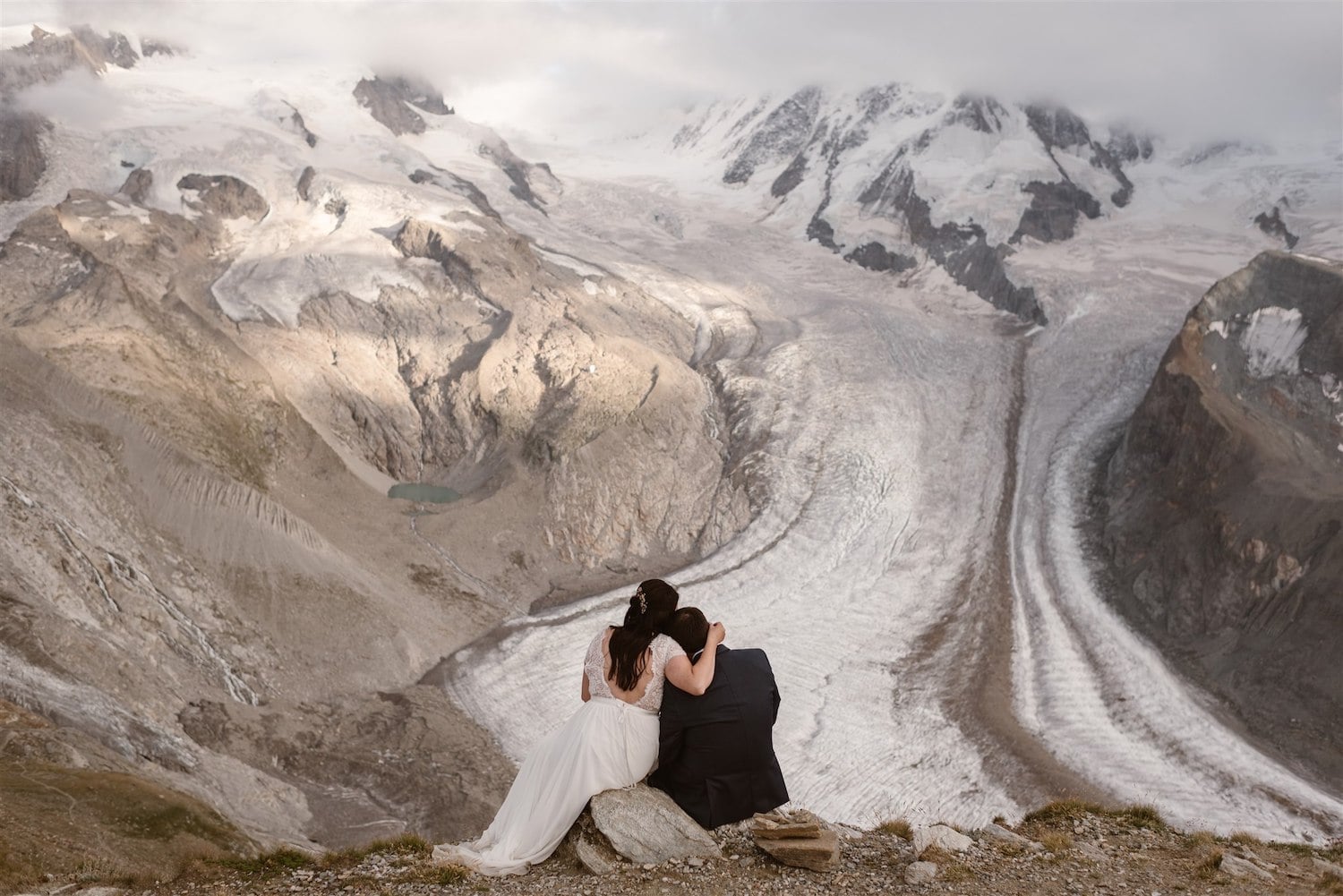 Couple looking at the mountain during their elopement in Switzerland