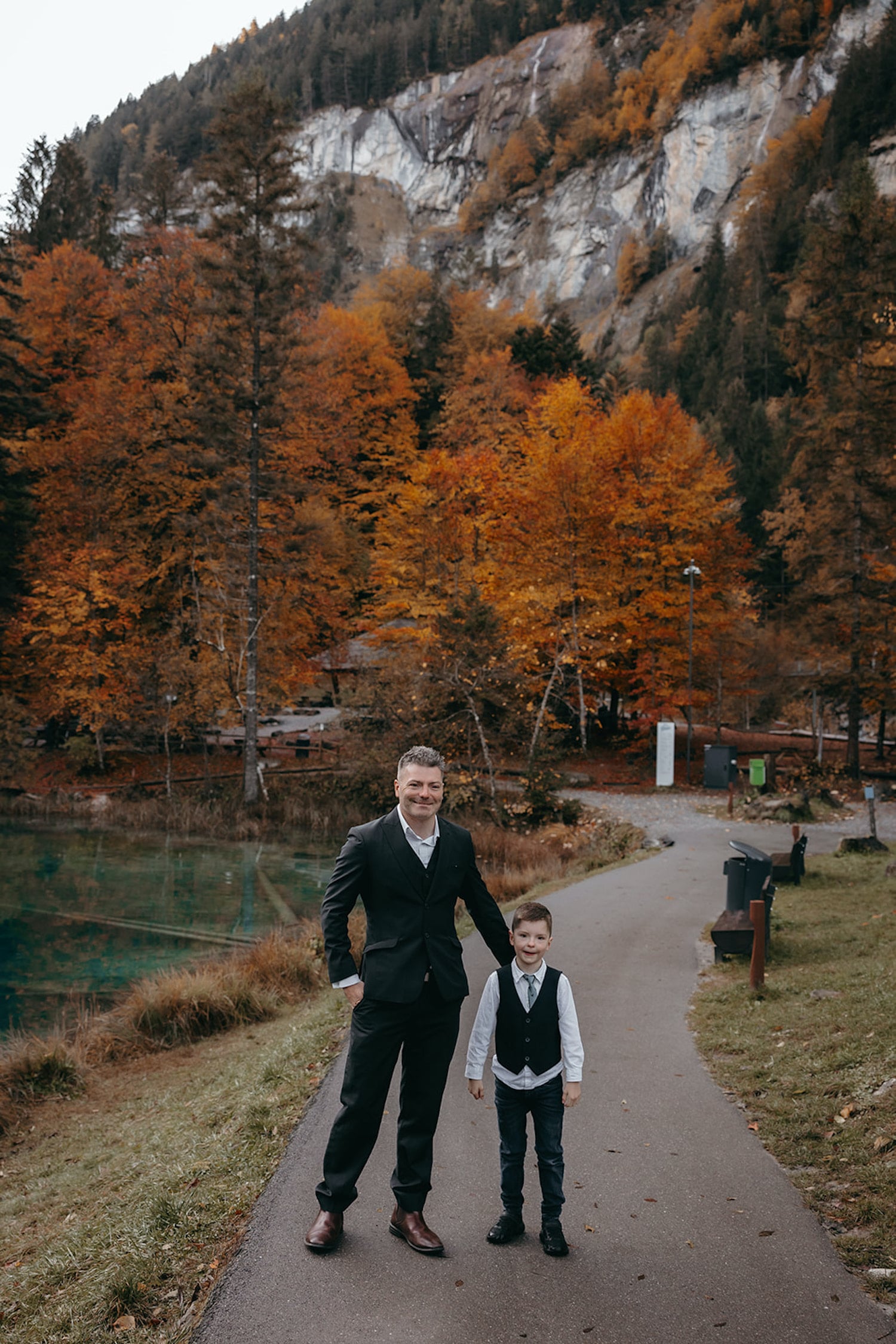 groom with his son during an elopement in Blausee