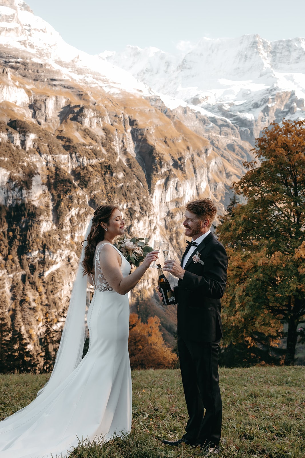 couple drinking champagne after their symbolic elopement ceremony, mürren
