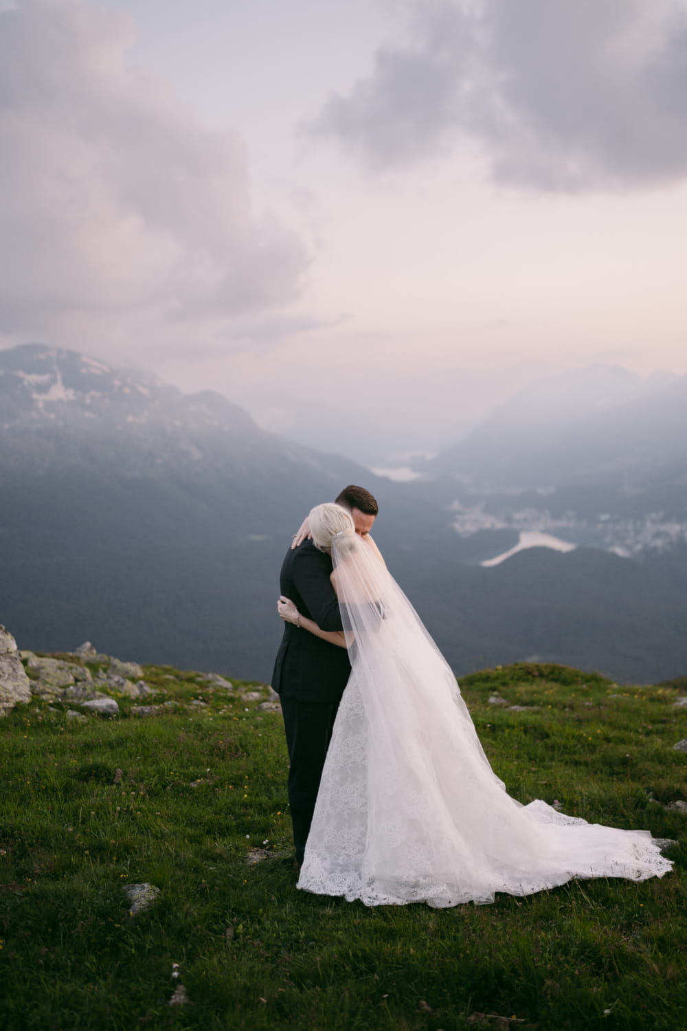 couple hugging at the end of their signature wedding ceremony in Switzerland