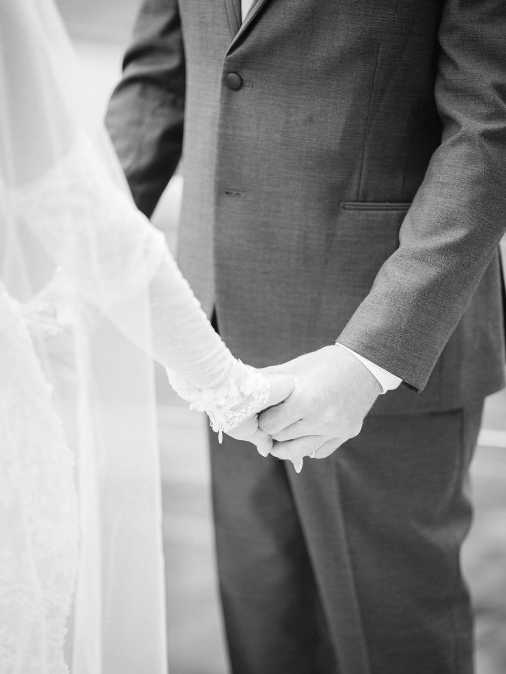 Couple holding hands during their ceremony with Marylin Rebelo