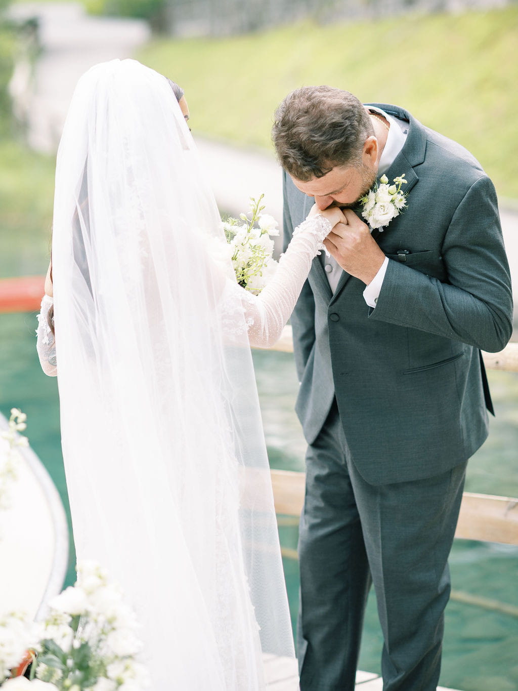 Groom kissing the bride's hand