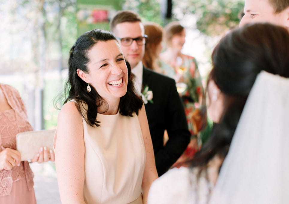 Celebrant looking and smiling at couple after their wedding ceremony in Switzerland