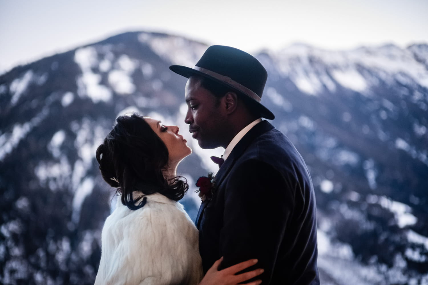 Multicultural couple kissing after their symbolic wedding in Switzerland